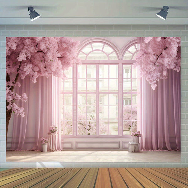a room with a large window and pink curtains