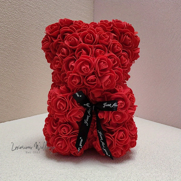 a teddy bear made out of red roses