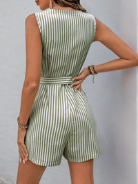 Back view of a woman in a striped V-neck belted romper, showing the tailored fit and chic design.