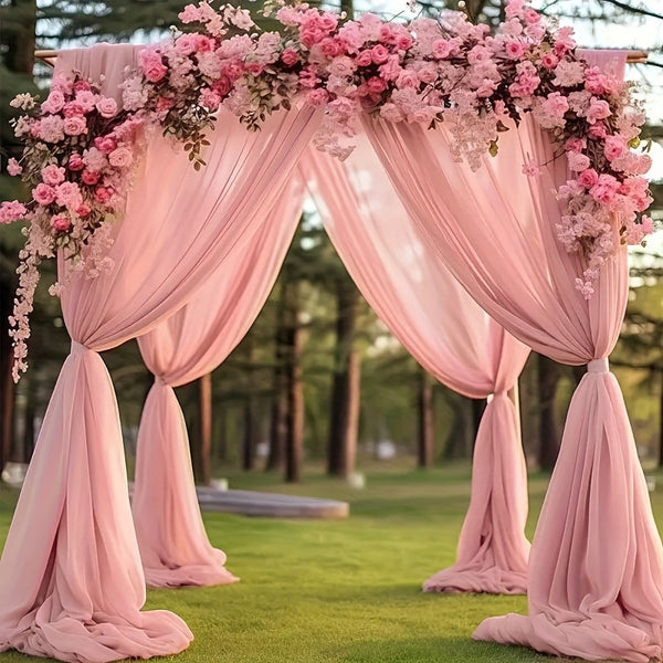 a pink wedding arch decorated with pink flowers
