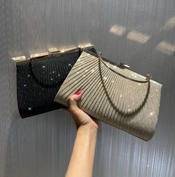 Luxurious pleated evening bags in black and gold, perfect for weddings and elegant occasions.