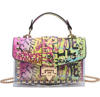Colorful studded handbag with graffiti print, combining luxury and playfulness for elegant women.