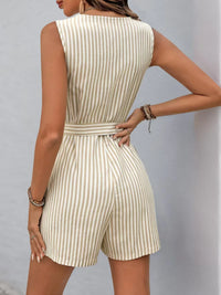 Back view of a striped V-neck belted romper with a tailored fit, featuring a button front and practical pockets.
