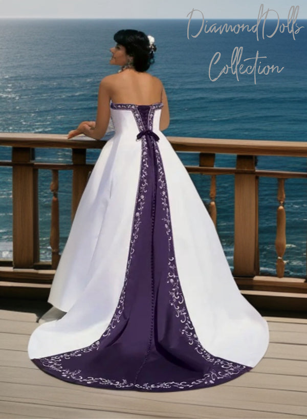 a woman in a wedding dress looking out at the ocean