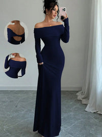 Model wearing a navy off-shoulder long sleeve bodycon maxi dress showcasing a backless design, perfect for luxurious weddings.