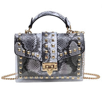 Elegant chains and rivet women's handbag, crafted from premium leather for luxurious weddings and stylish occasions.