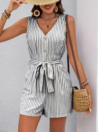 Striped V-neck belted romper featuring button front detail and pockets, perfect for summer styling.