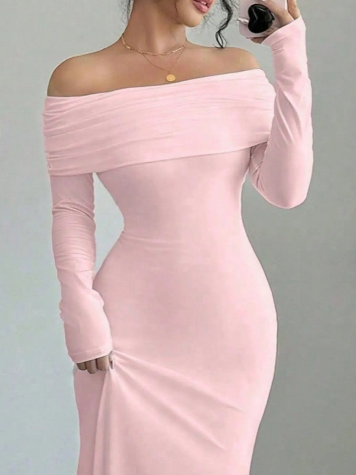 Elegant off-shoulder long sleeve bodycon maxi dress in soft pink, perfect for luxurious weddings or special occasions.