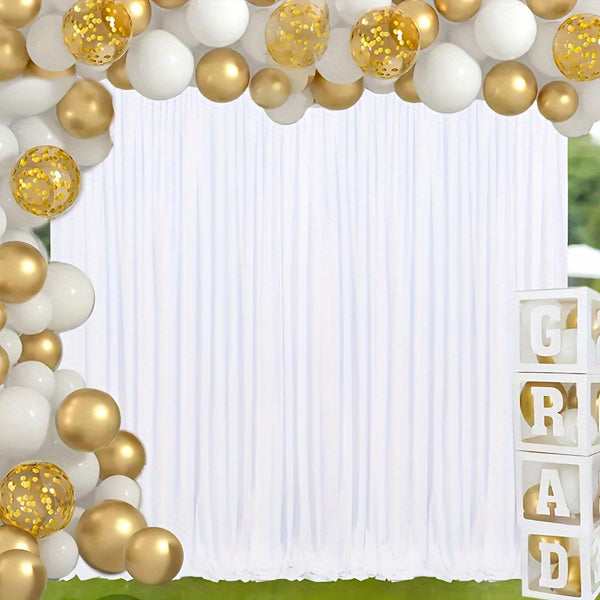 a white and gold wedding arch with balloons
