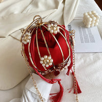 Luxurious diamond pearl flower metal ball handbag in red, perfect for elegant weddings and stylish occasions.
