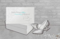 Elegant bridal heels from the Something Blue, Something Borrowed collection, showcased with their signature box.