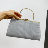 Elegant pleated shiny evening handbag for luxurious weddings, featuring a stylish handle and premium craftsmanship.