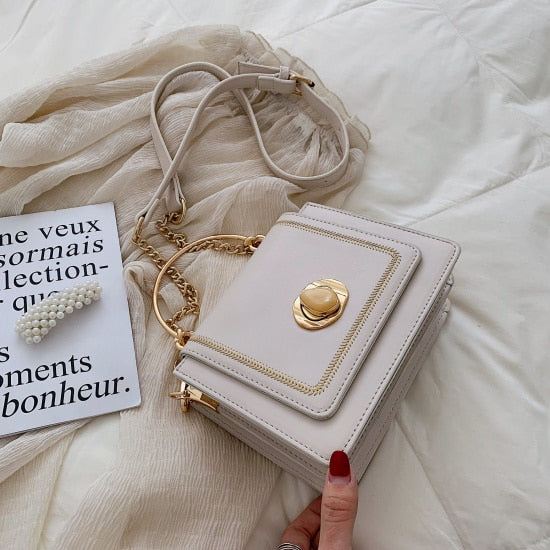 Elegant leather mini crossbody bag for women, perfect for luxurious weddings and versatile style.