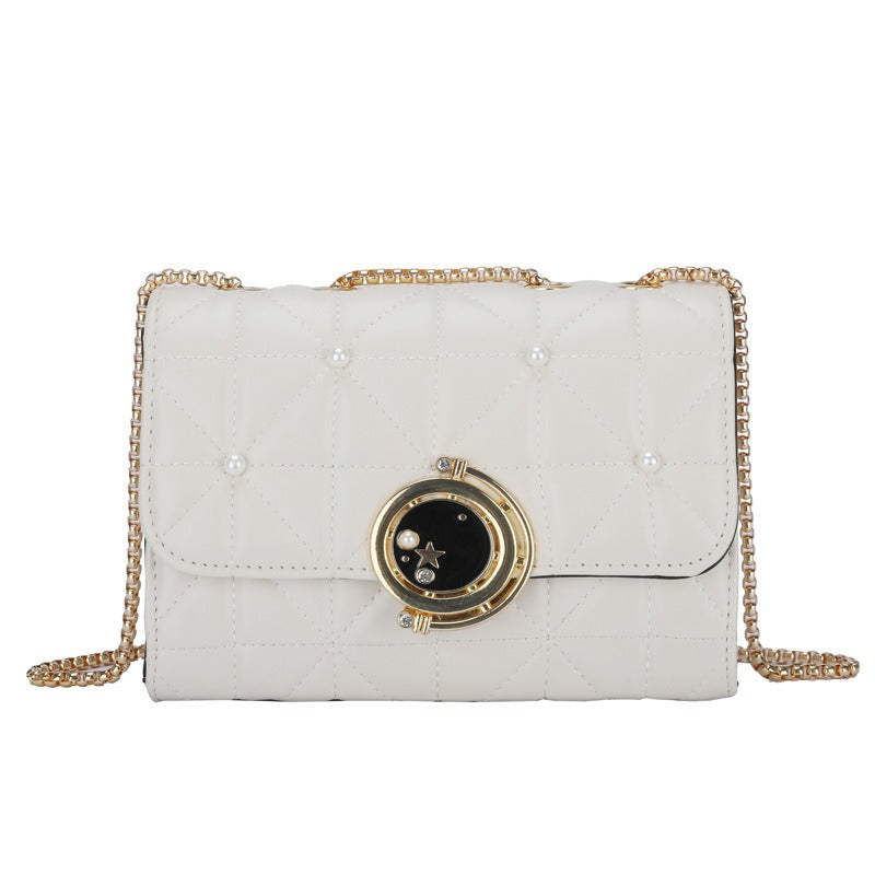 Elegant white leather crossbody bag with gold chain, perfect for luxurious weddings and modern occasions.
