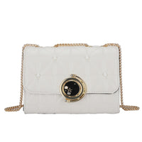Elegant white leather crossbody bag with gold chain, perfect for luxurious weddings and modern occasions.