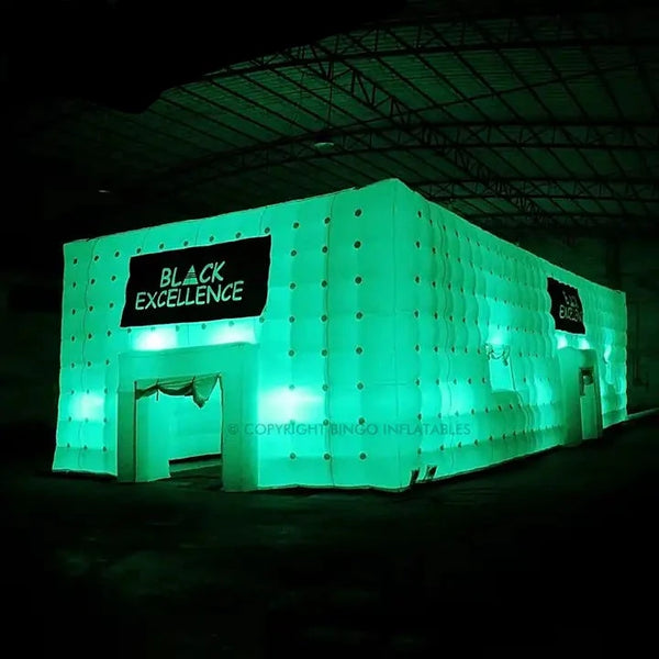 a large inflatable building with a black excellence sign on it