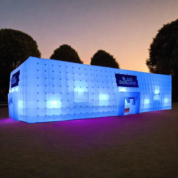 an inflatable building is lit up at night