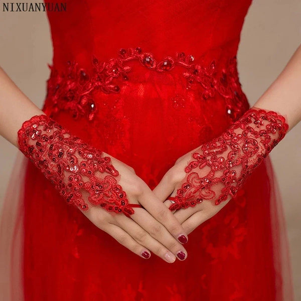 a woman in a red dress holding her hands together