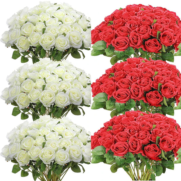 a bunch of red and white roses in a vase