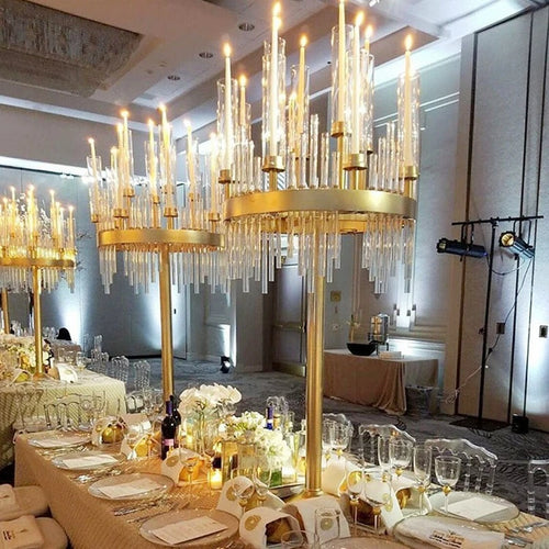 a long table with a chandelier hanging from the ceiling