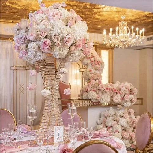 a tall vase filled with pink and white flowers
