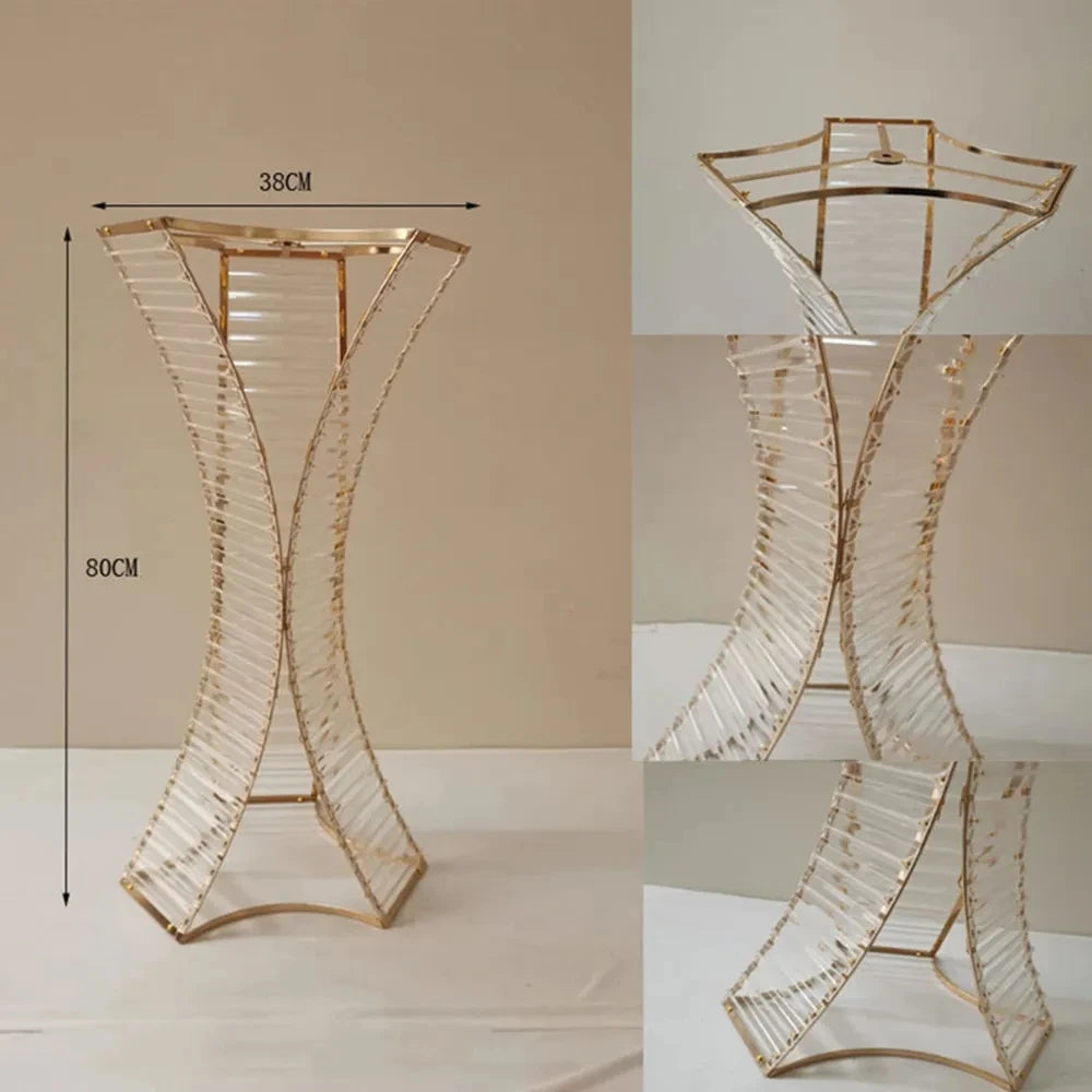 a tall glass vase sitting on top of a table