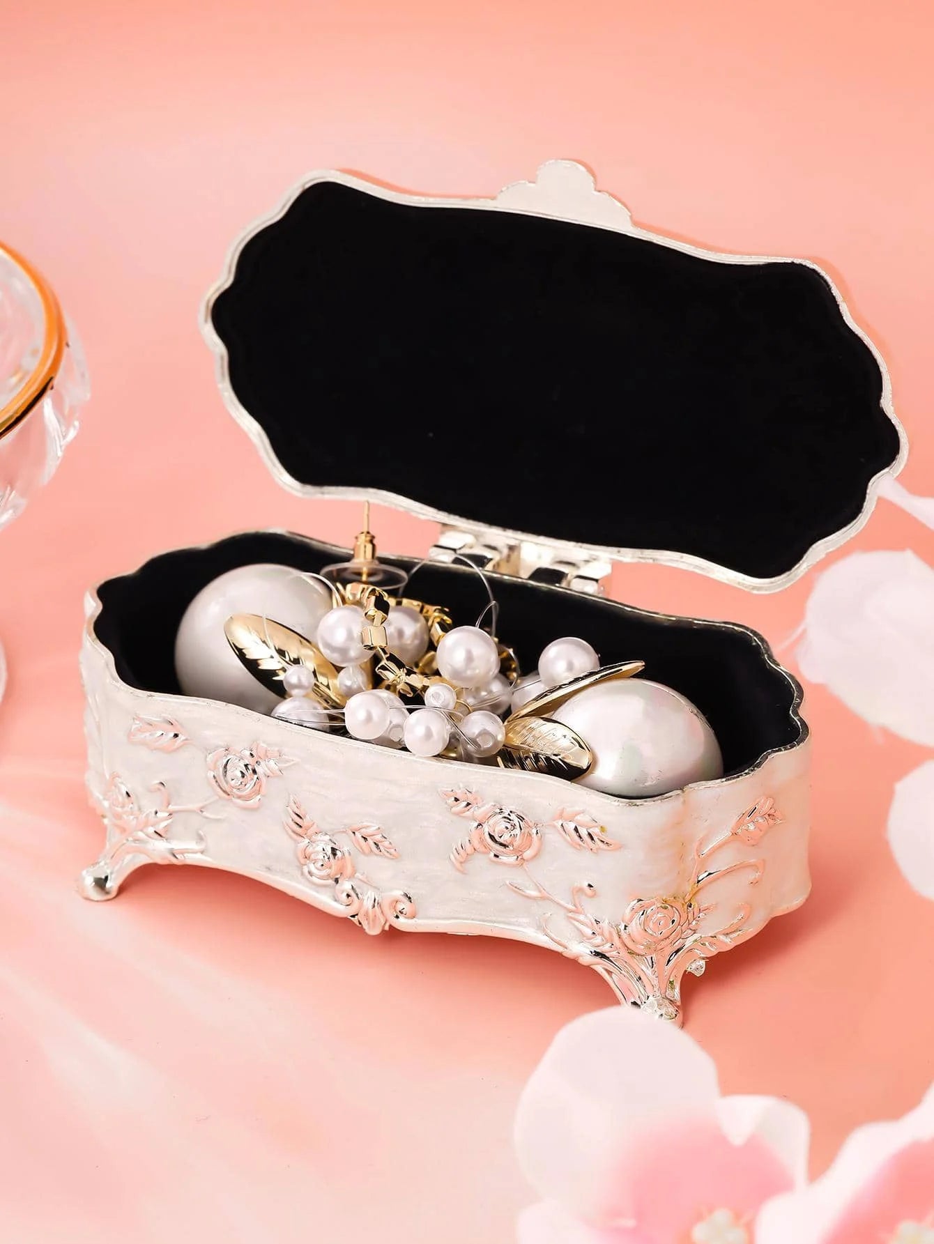 a white box filled with ornaments on top of a table