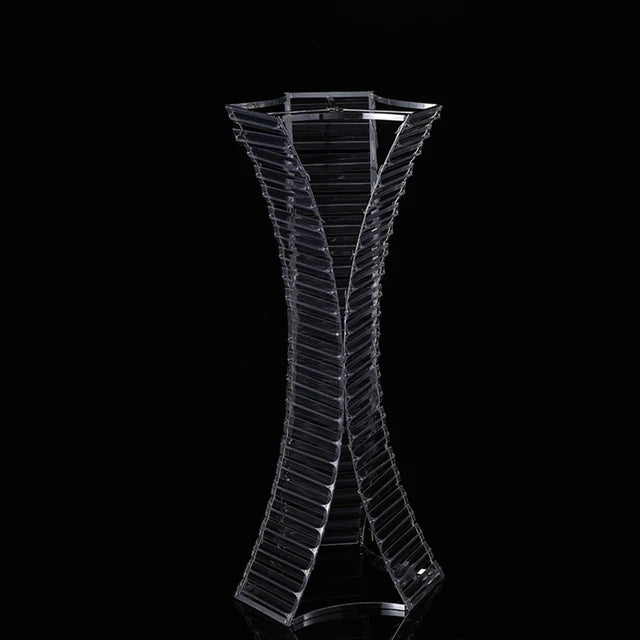 a glass vase with a curved design on it