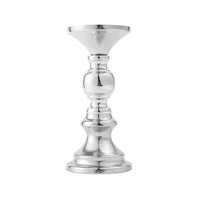 a silver candle holder on a white background