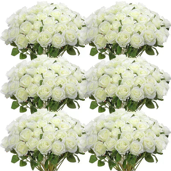 a bunch of white roses in a vase