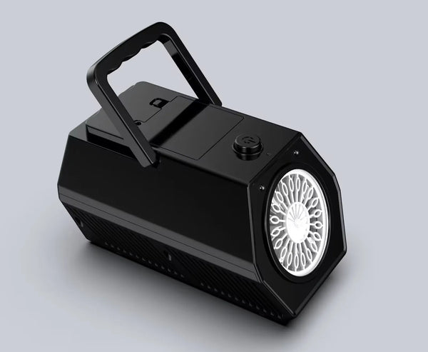 a black speaker with a white light on top of it