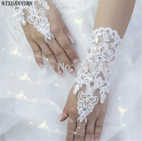 a woman in a wedding dress wearing a white lace wrist length garter