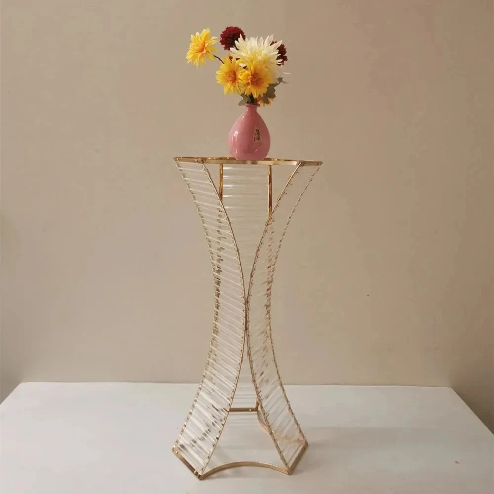 a vase with yellow and white flowers in it