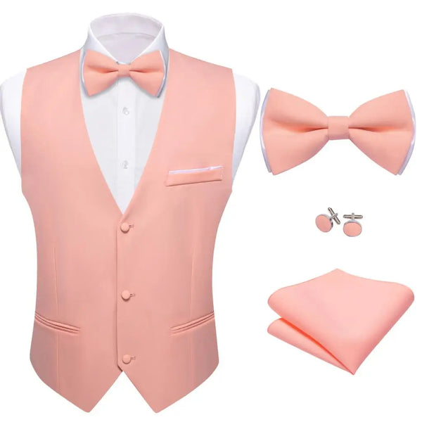 a pink vest, tie, and cufflinks with a white shirt