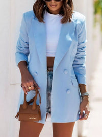 Light blue lapel collar long sleeve blazer styled with a white crop top and denim shorts, perfect for luxurious weddings.