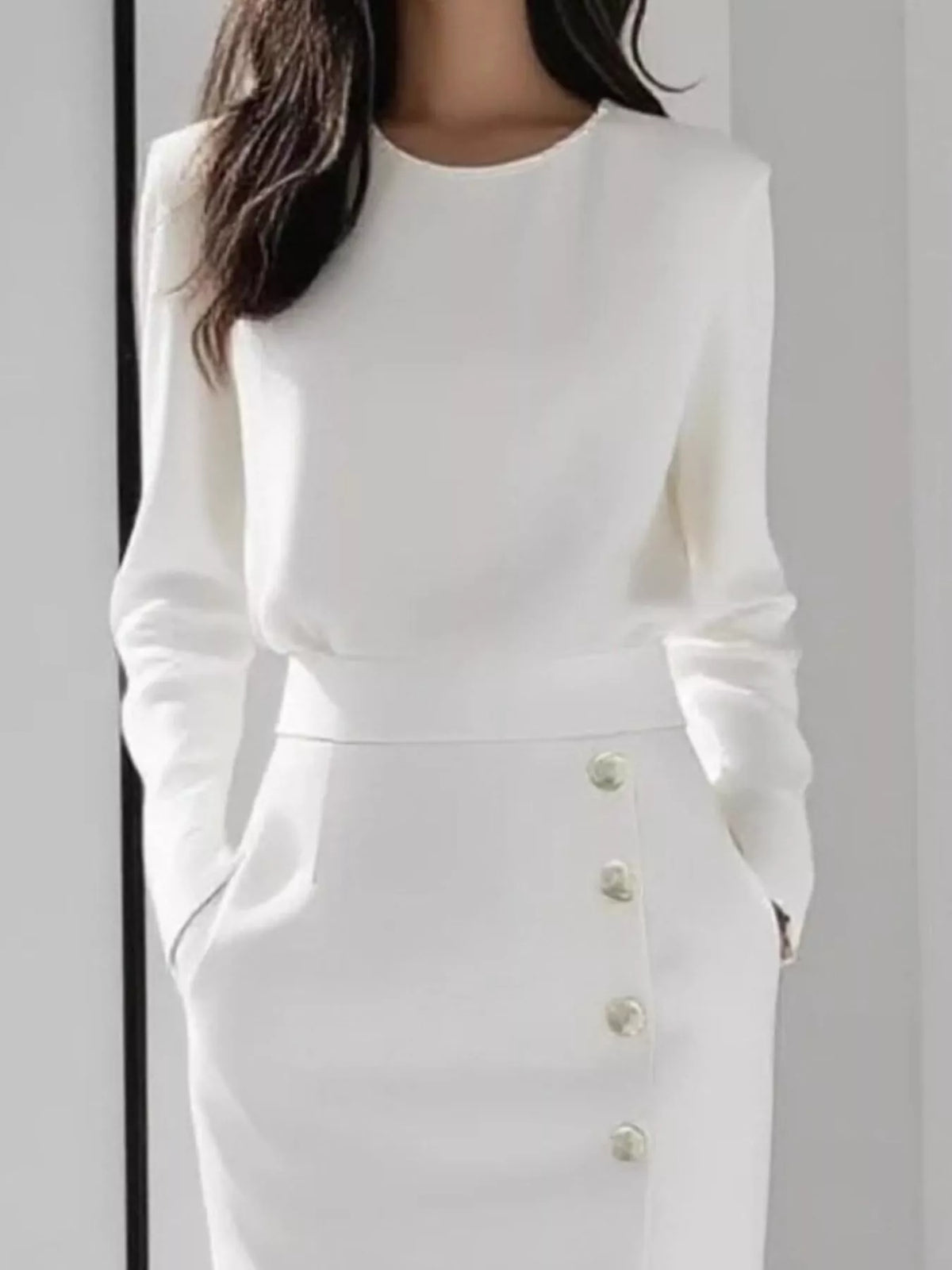 Long Sleeve Button Detail Midi Dress with Side Slit showcasing button details and pockets in a stylish white design.