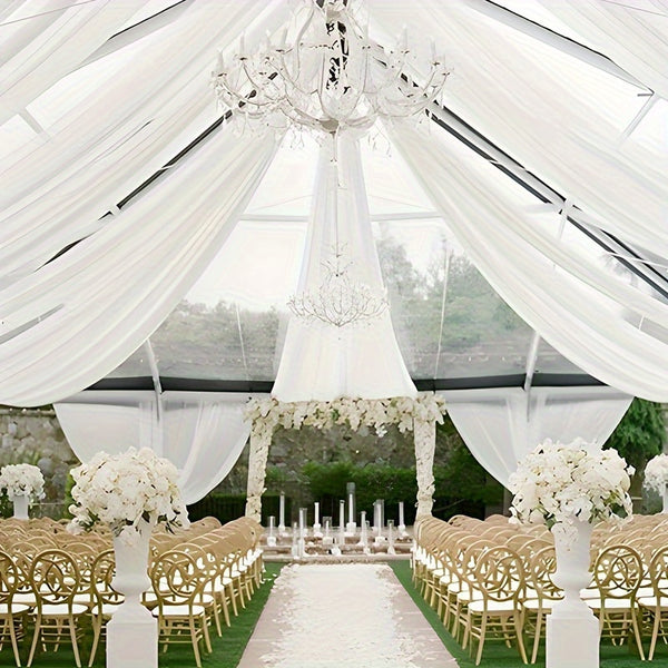 a wedding ceremony setup with white flowers and gold chairs