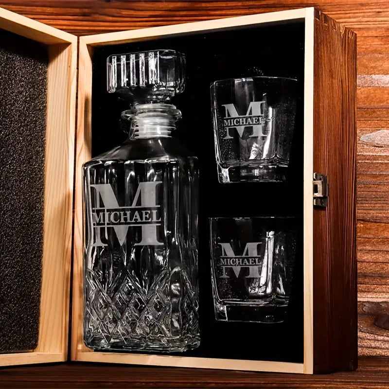 Engraved decanter set with personalized glasses in wooden gift box, ideal for special occasions.