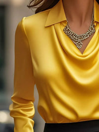 Ruched Long Sleeve Drape Collar Blouse in yellow with a stylish draped collar and elegant necklace accessory.