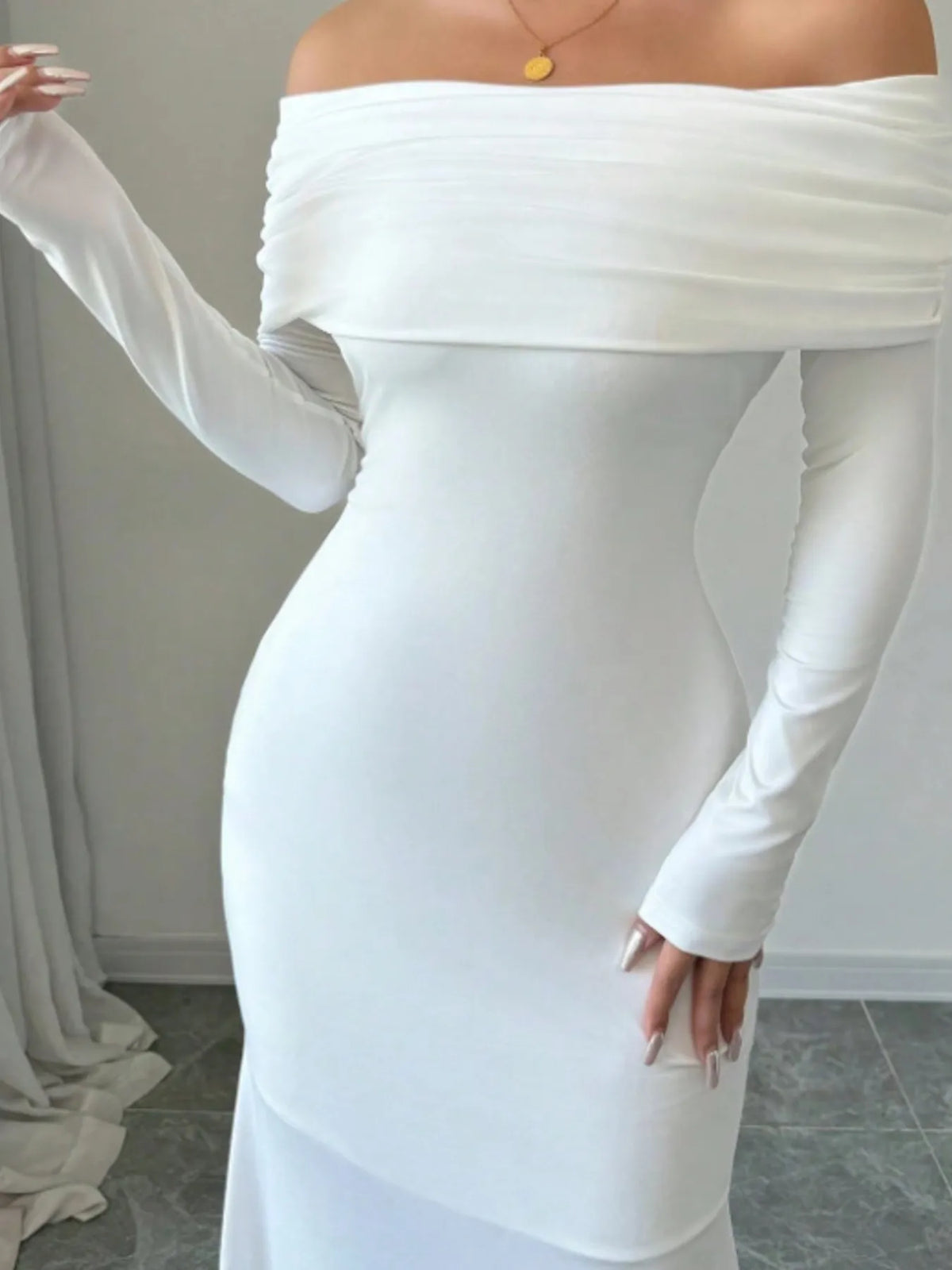 Off-shoulder long sleeve bodycon maxi dress in white, perfect for luxurious weddings and special occasions.