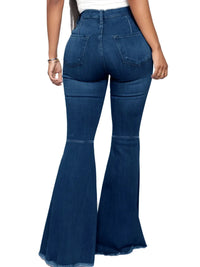 Back view of plus-size high-waisted raw hem flare jeans, showcasing the fitted waist and flared bottoms in dark denim.