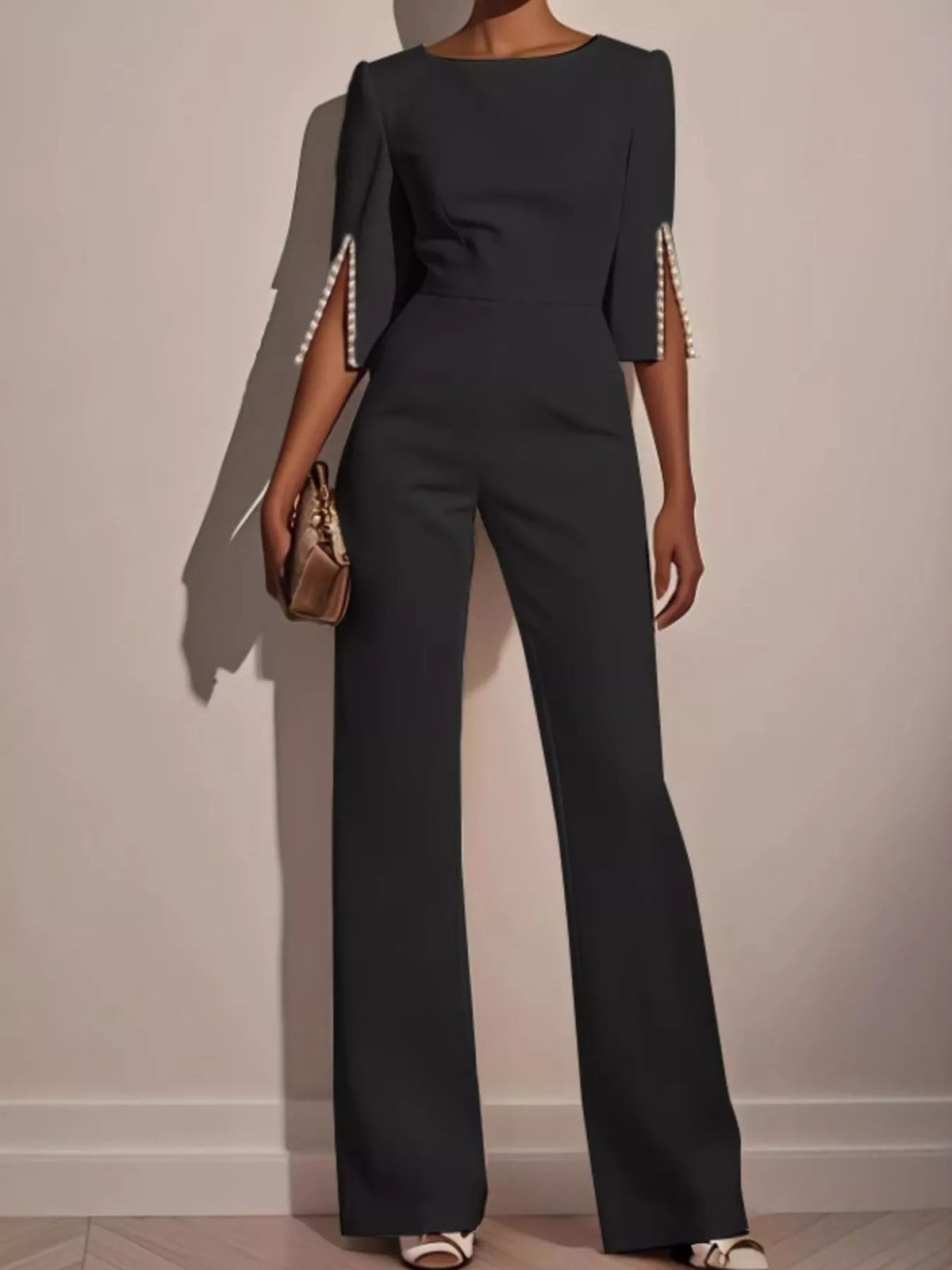 Wide-Leg Jumpsuit with Slit Sleeve in dark color with pearl detailing on sleeves.