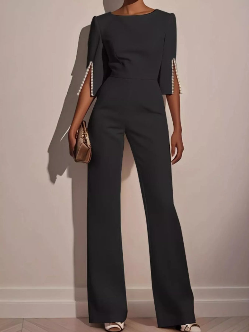 Wide-Leg Jumpsuit with Slit Sleeve in dark color with pearl detailing on sleeves.