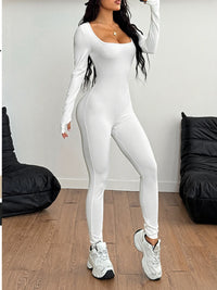 Model wearing a square neck long sleeve active jumpsuit in white, showcasing a stylish and flattering fit. Ideal for affordable activewear.