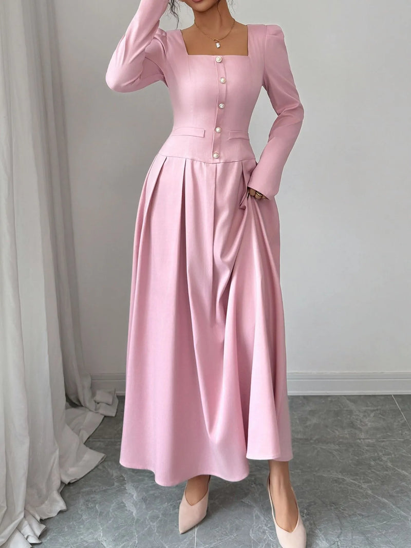 Stylish square neck long sleeve maxi dress in pink with decorative buttons and pleated skirt.