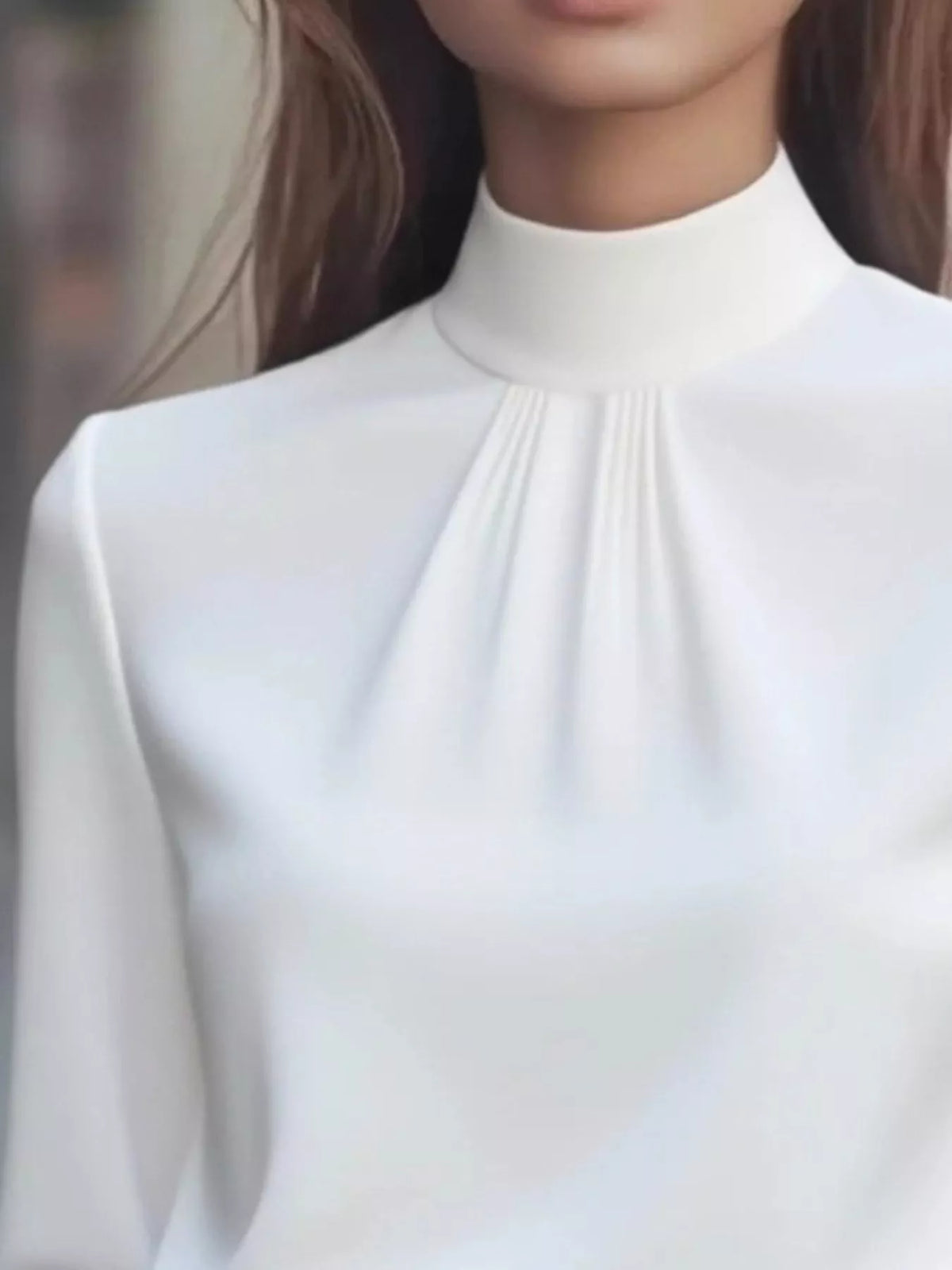 Mock Neck Long Sleeve Blouse with Pleated Detail in white fabric, showcasing pleated design and elegant silhouette.