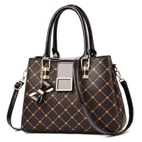 Luxurious black woman's bag with gold accents, perfect for elegant weddings and special occasions.