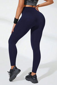 High waist active leggings in navy blue, showcasing a stretchy and comfortable fit for workouts.