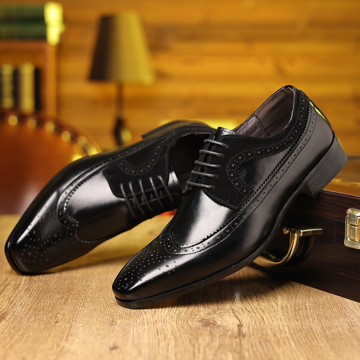 Men's vintage leather shoes in sleek black with refined toe cap, perfect for luxurious weddings and formal events.