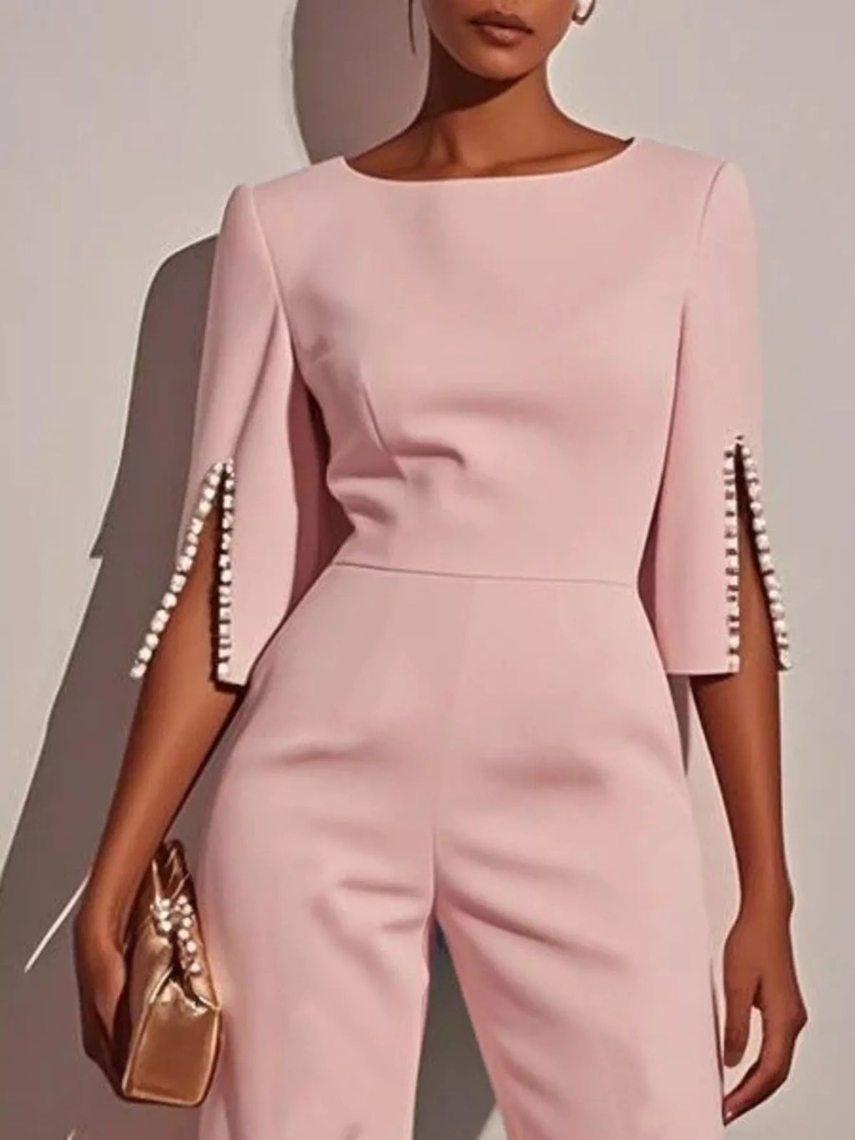 Wide-Leg Jumpsuit with Slit Sleeve in soft pink with decorative pearl details on sleeves.
